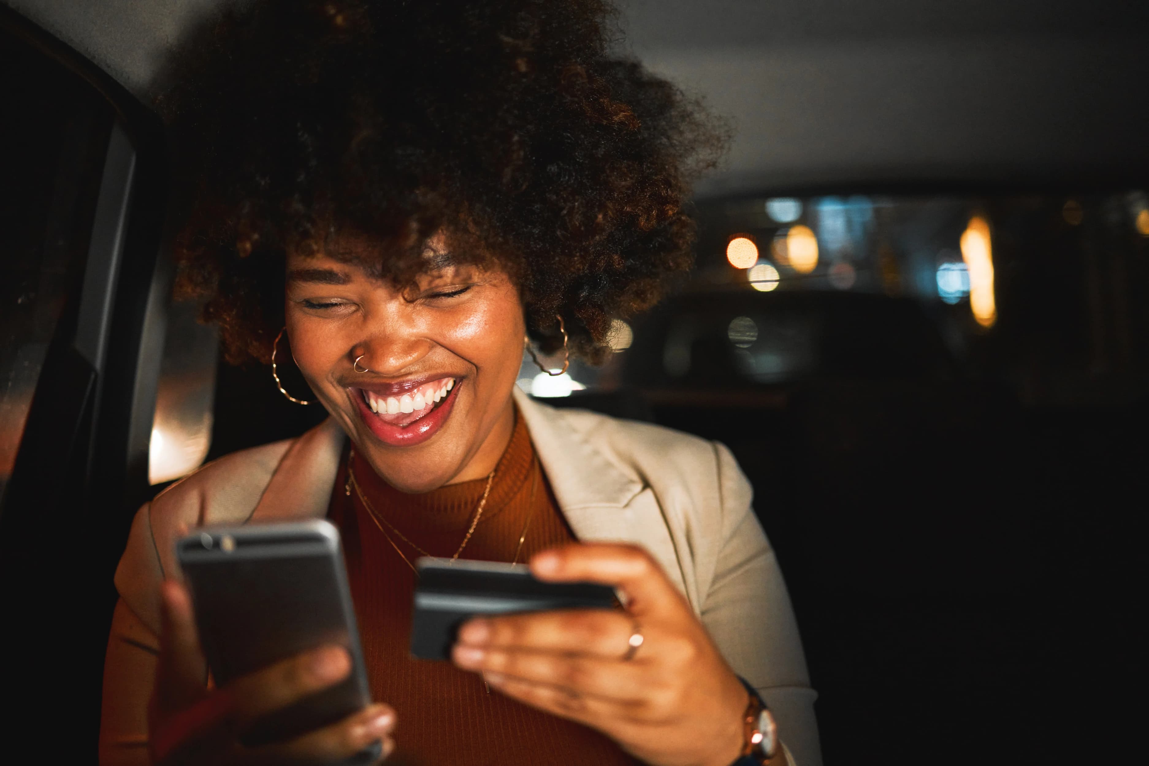 Woman with smartphone and card