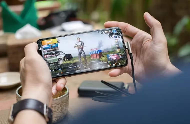 Player enjoying a mobile game on their phone
